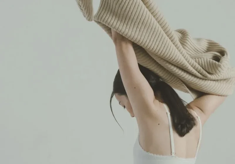 woman changing into clothes that defines her