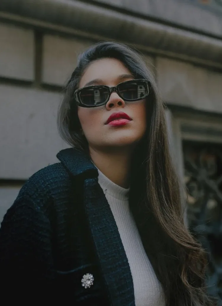 sassy woman with red lipstick in sunglasses