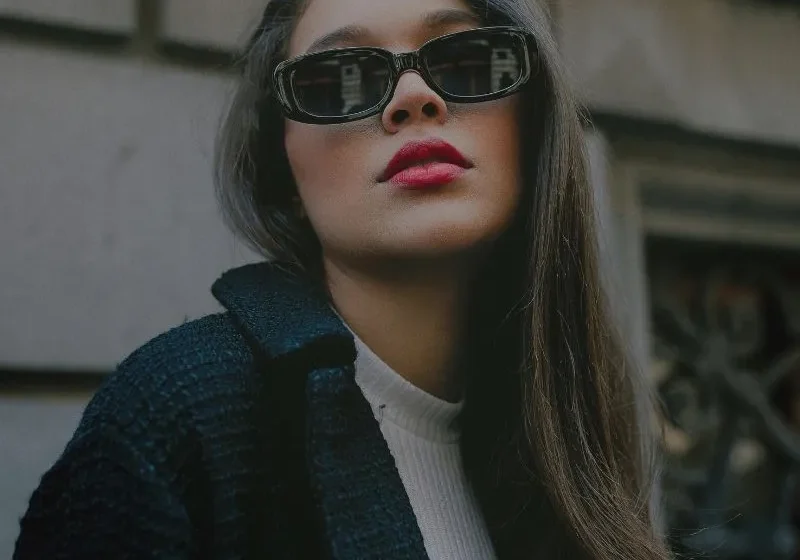 sassy woman with red lipstick in sunglasses