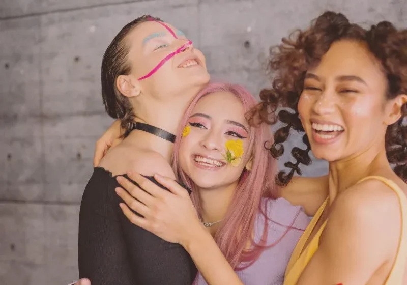 three happy high school girl friends