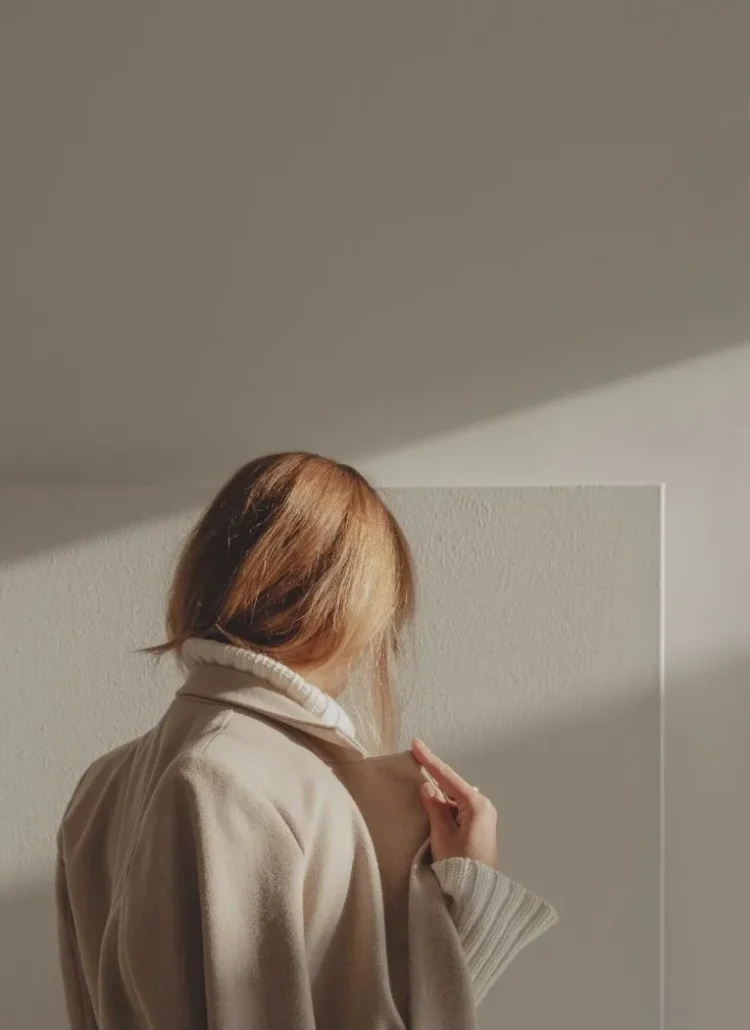 woman looking at a art canvas