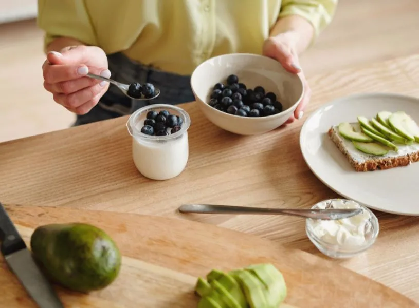 woman preparing healthy breakfast as part of morning habit and routine