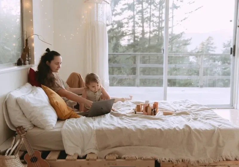 mother and daughter in bed having a connection and bonding moment
