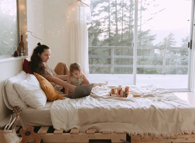 mother and daughter in bed having a connection and bonding moment