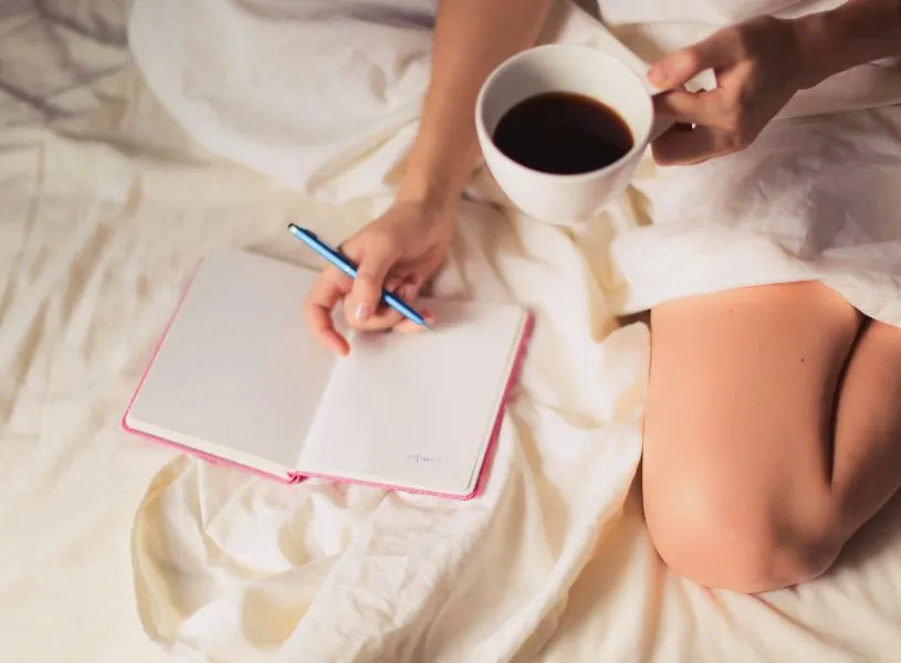 woman doing morning journal to improve mental health
