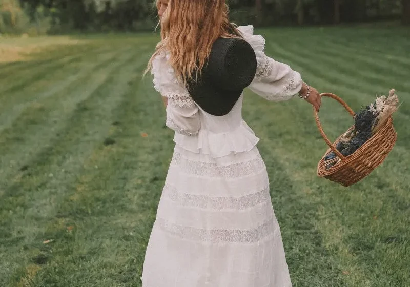 woman wearing white dress in grass field