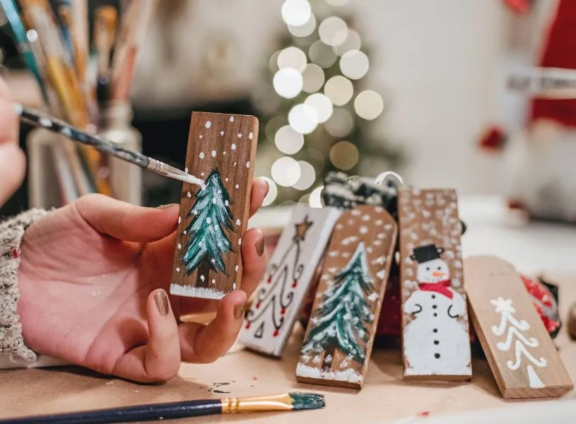 woman painting xmas tree