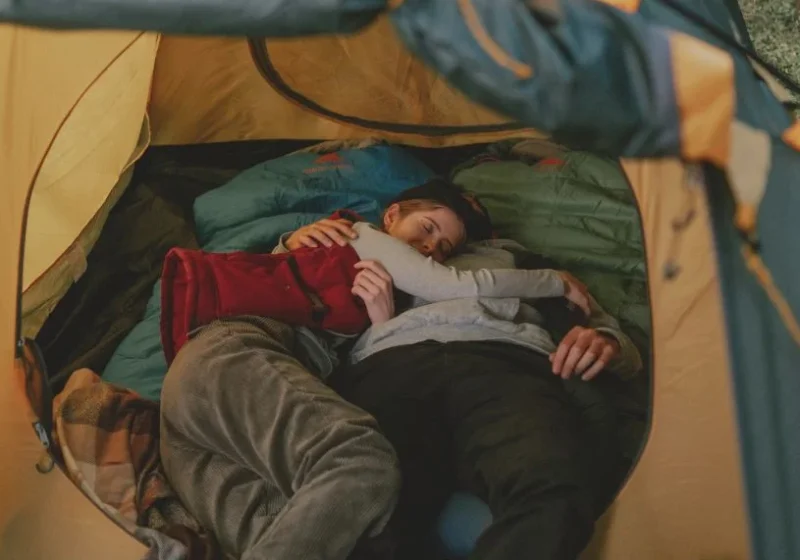 couple hugging each other inside a tent