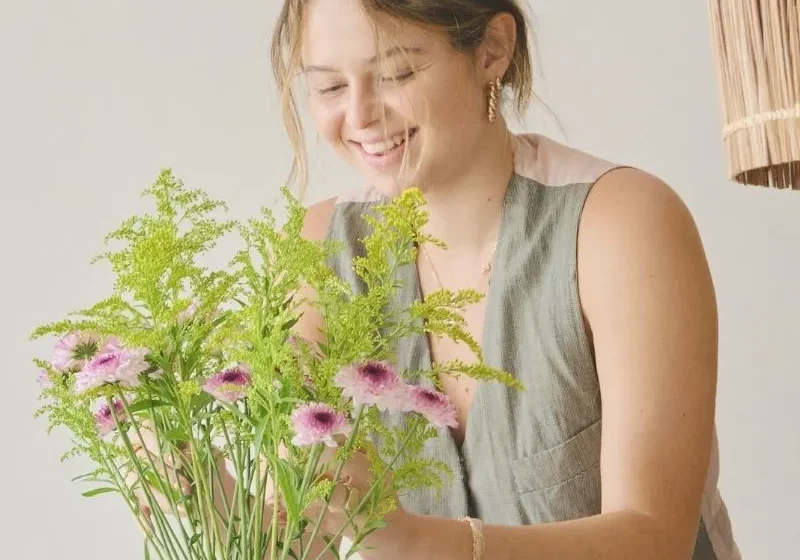 woman arranging flowers 