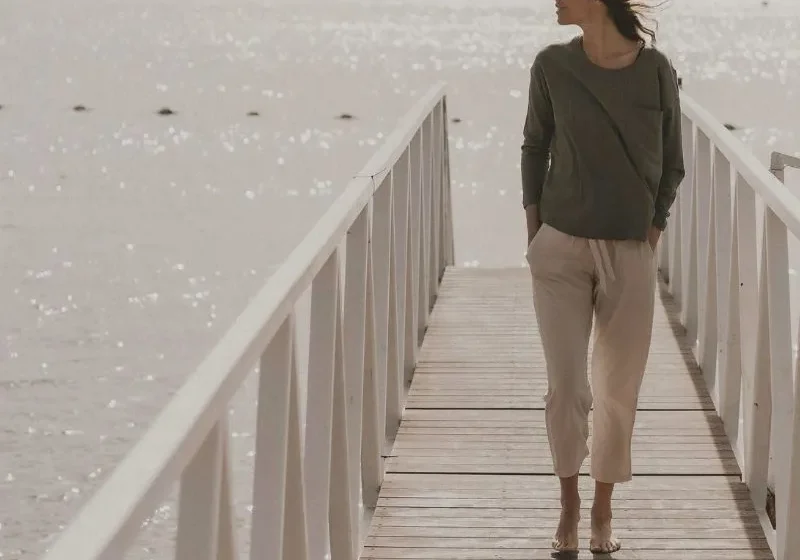 woman walking by herself on the bridge