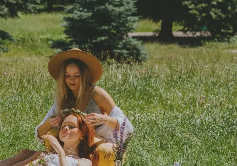 two girlfriends having picnic in the park