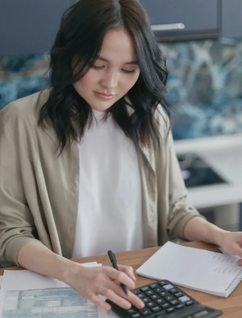 woman doing with calculator doing financial planning