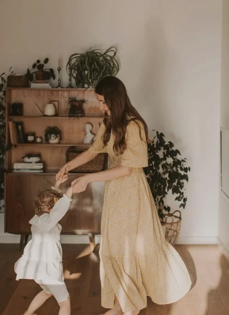 mother and daughter dancing together