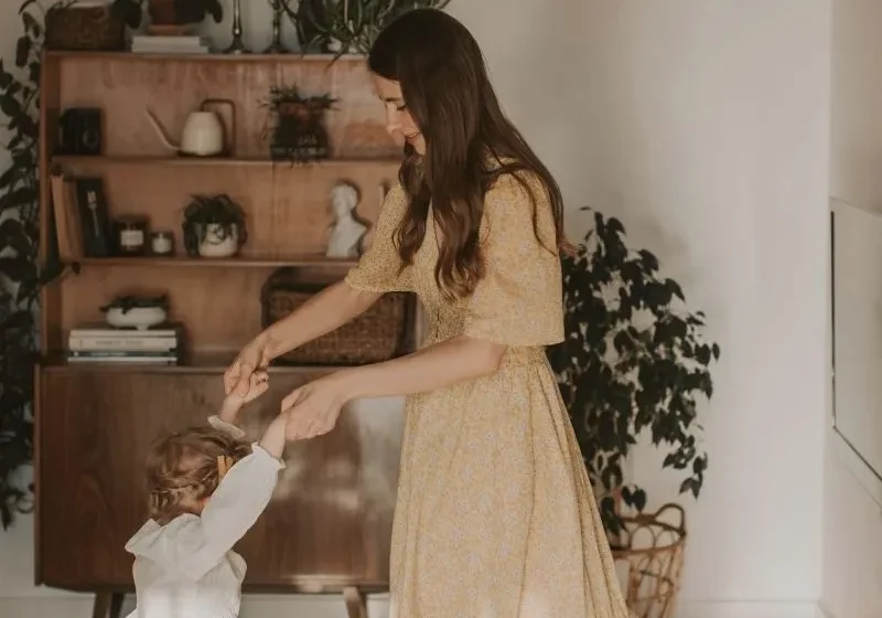mother and daughter dancing together