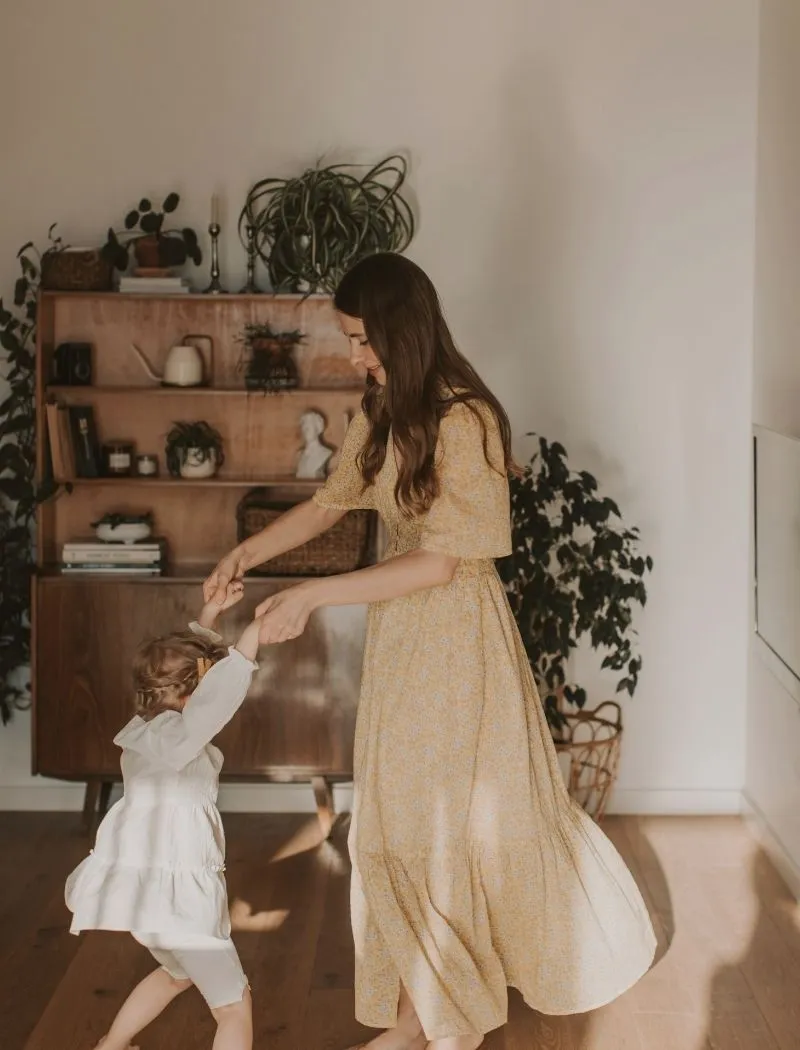 mother and daughter dancing together