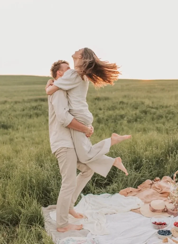 couples hugging in a picnic setting