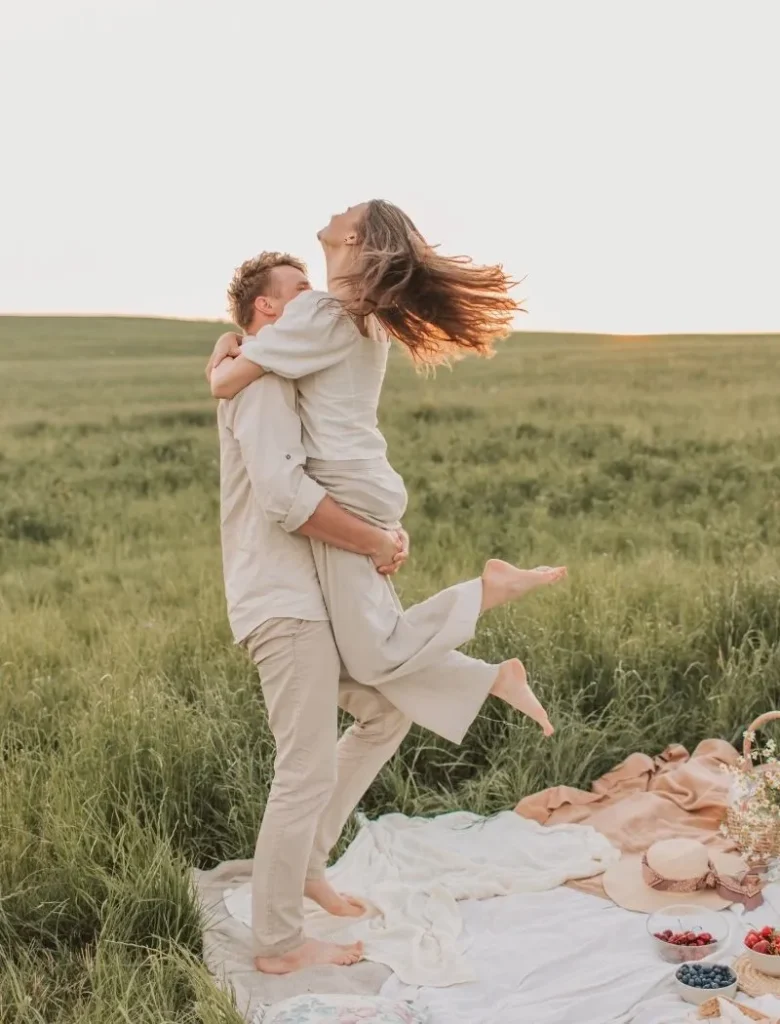 couples hugging in a picnic setting