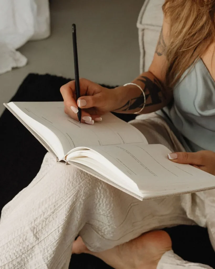 woman writing in her journal